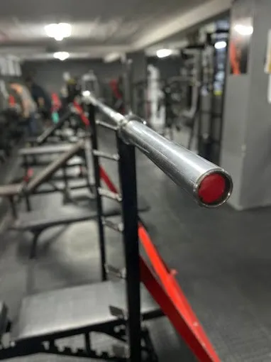 Barbell resting on a rack